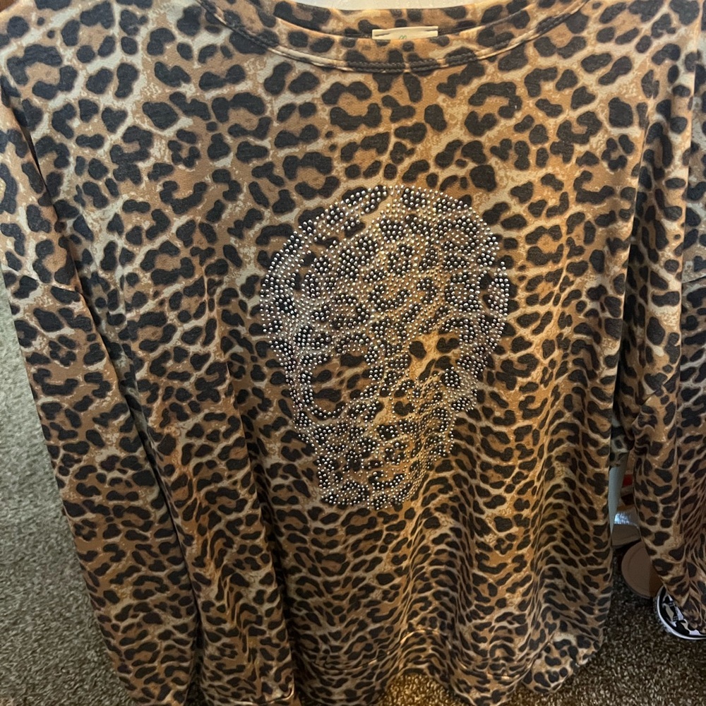 Never worn, blue buttercup leopard sweatshirt with rhinestones